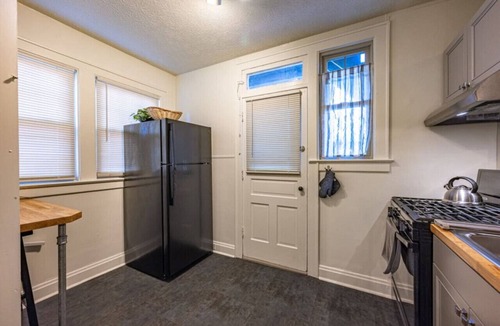 Clintonville Apartment | Clintonville Gem Fireplace Modern Kitchen