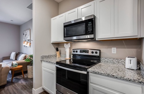 Bel Aire House | Close Drive to Wichita Hoops. Garage Parking + W&D