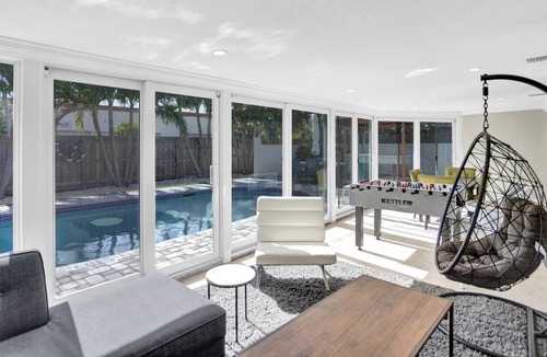 Coral Heights House | Close to the Beach! Heated pool, tiki bar, & BBQ