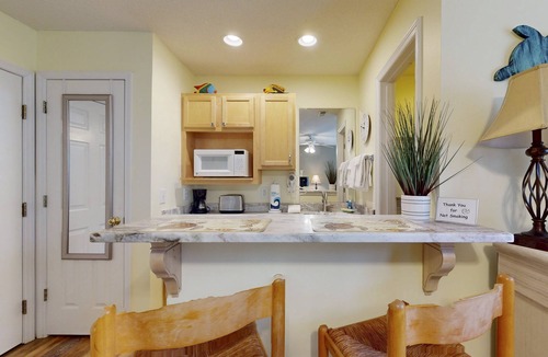 St. James Condo | Coastal Condo with golf course view and shared pool access