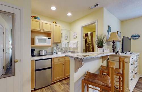 St. James Condo | Coastal Condo with golf course view and shared pool access
