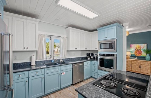 El Centro Beach House | Coastal Cutie ~ Pet-Friendly Beach Haven with Hot Tub & Fenced Backyard