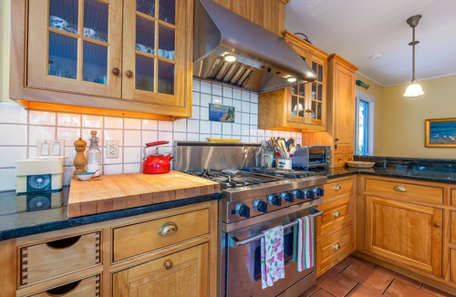 Harpswell House | Coastal Hideaway. Water views with expansive deck, pool table, office area.