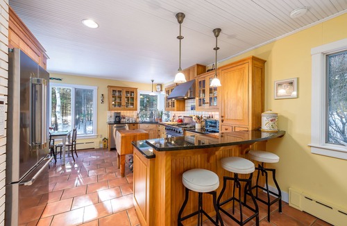 Harpswell House | Coastal Hideaway. Water views with expansive deck, pool table, office area.