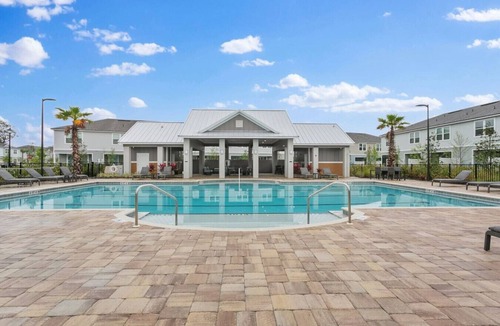 Baymeadows House | Coastal Living - Games/Pool/Volleyball
