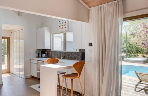 Beach Hampton House | Coastal-style home with private pool, open-floor plan, ample natural.