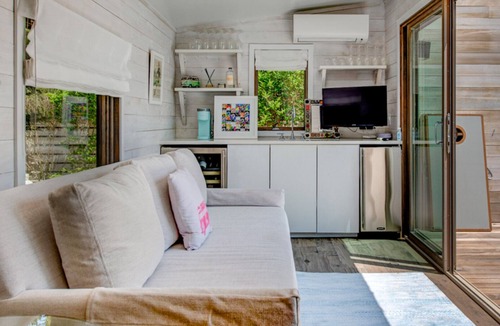 Beach Hampton House | Coastal-style home with private pool, open-floor plan, ample natural.