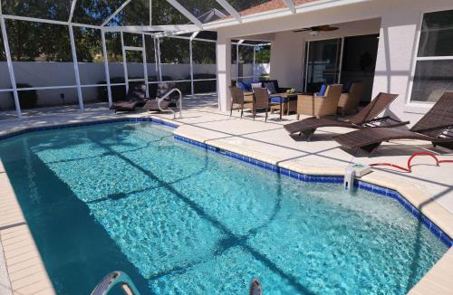 The Villages Villa | Coconut Courtyard, Tiki Hot Tub, Private Pool & Courtyard Retreat
