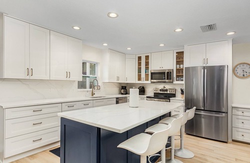 Pelican House | Coconut Cove Home with Sunny South-Facing Family Pool, Canal & Boat Dock