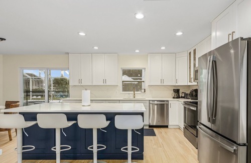 Pelican House | Coconut Cove Home with Sunny South-Facing Family Pool, Canal & Boat Dock