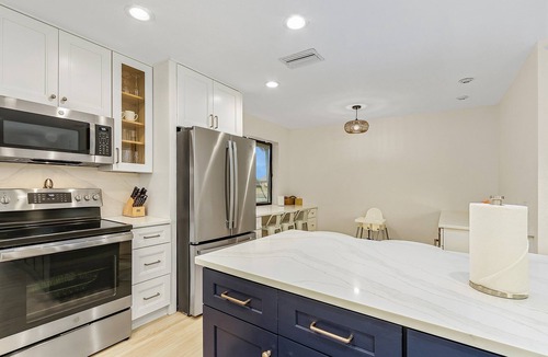 Pelican House | Coconut Cove Home with Sunny South-Facing Family Pool, Canal & Boat Dock