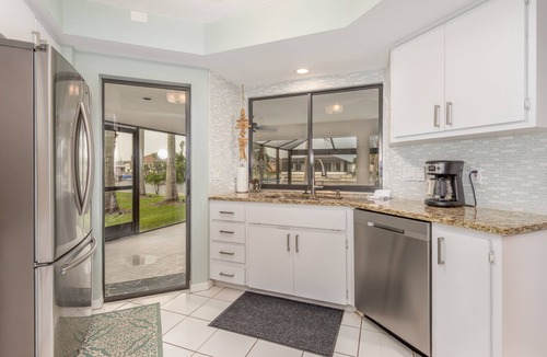 Pelican House | Coconut Cove/Scenic Waterfront Escape with Private Heated Pool & Spa