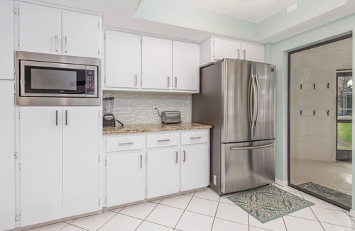 Pelican House | Coconut Cove/Scenic Waterfront Escape with Private Heated Pool & Spa