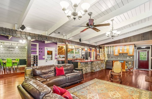 Shoreline House | Colorful dog-friendly getaway with covered deck, firepit, fast WiFi, & grill