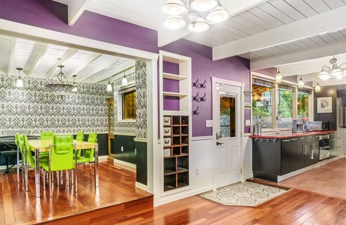 Shoreline House | Colorful dog-friendly getaway with covered deck, firepit, fast WiFi, & grill