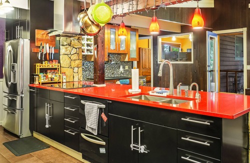 Shoreline House | Colorful dog-friendly getaway with covered deck, firepit, fast WiFi, & grill