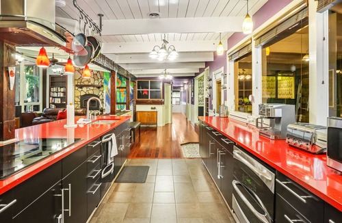 Shoreline House | Colorful dog-friendly getaway with covered deck, firepit, fast WiFi, & grill