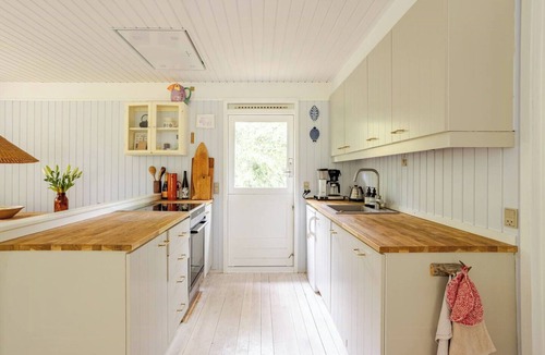 Hoeve Strand House | Colourful details in wooden house on nature plot