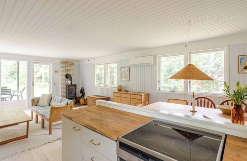 Hoeve Strand House | Colourful details in wooden house on nature plot