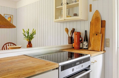 Hoeve Strand House | Colourful details in wooden house on nature plot