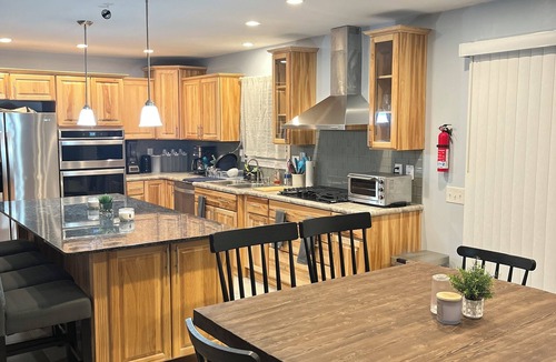 Gilford House | Comfortable and Spacious Home: Entertainment room, Gym + large deck and patio