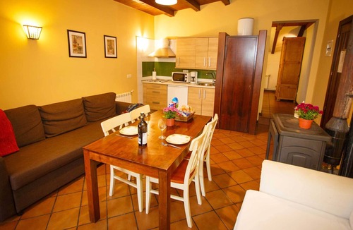 Robregordo Ski Chalet | Comfortable bedroom apartment sofa bed and fireplace on the first floor