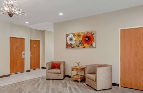 Eastside Promise Neighborhood Hotel | Comfortable Room w/Complimentary Breakfast - Perfect for a Restful Stay