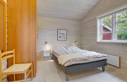 Ertebølle House | Comfortably furnished cottage with kitchen-living room and a fireplace in the living area.