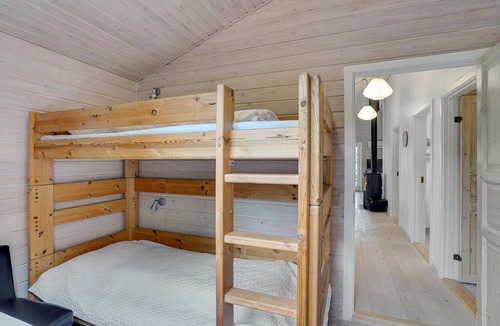 Ertebølle House | Comfortably furnished cottage with kitchen-living room and a fireplace in the living area.