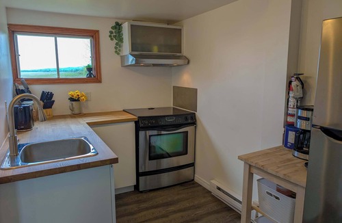 Ste Anne de Beaupre Apartment | Condo 2 - Bord de l'eau, SPA, Barbecue & Foyer