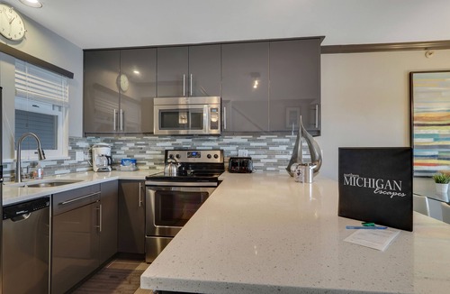 Boyne City Condo | Condo with Lake Charlevoix Views | Private Beach Access | Gas Log Fireplace
