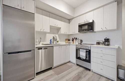 Kitchener Apartment | Contemporary Condo in DTK | Gym, Pool, & More