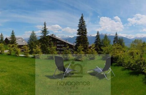 Anzere Apartment | Contemporary flat with a garden. Warmly decorated; a large living room with a dining room and a bea
