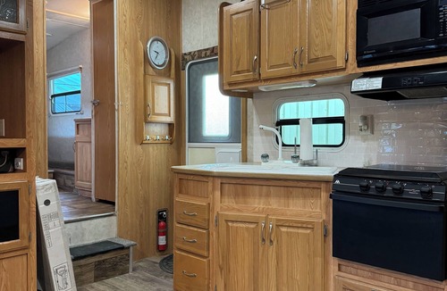 Schoharie RV Rental | Convenient Campsite W/fifth wheel camper, Creek Front.