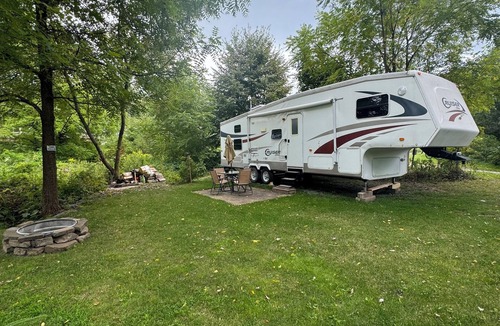 Schoharie RV Rental | Convenient Campsite W/fifth wheel camper, Creek Front.