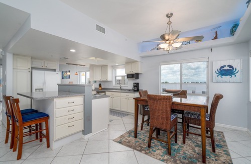 South Island Condo | Corner Unit Top Floor | Bay Views, Pool & Walk to Beach Access