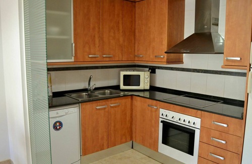 Sant Carles de la Rapita Apartment | Cosy apartment for 3 guests with pool, A/C, TV and balcony