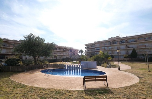 Sant Carles de la Rapita Apartment | Cosy apartment for 3 guests with pool, A/C, TV and balcony