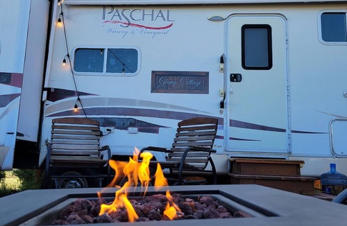 Talent House | Cottage features a queen-sized bed, dining area, and full kitchen.