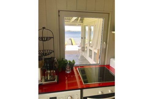 Bjert House | Cottage on grassy plot with panoramic views of the water and outdoor Jacuzzi