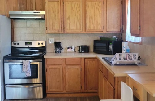 Lake Village Cabin | Cottage tucked in back of orchard with full kitchen and lake access!