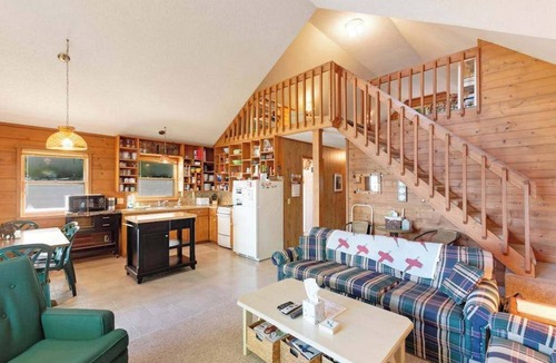 Boyne City House | Cottage with lake views, private dock & firepit - near public boat launch