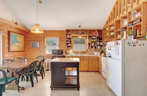 Boyne City House | Cottage with lake views, private dock & firepit - near public boat launch