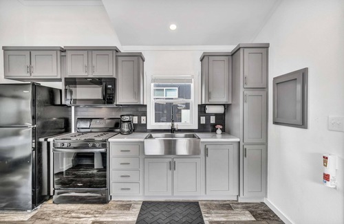 Brenham Cottage | Cottage with Loft - Pet Friendly - Includes 3 queen beds (one in master and 2 in loft), a fully equipped kitchen, dining area, private bath and shower, TVs, Wifi, all utilities, access to all resort amenities. This cottage is pet friendly.