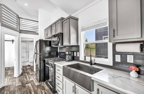 Brenham Cottage | Cottage with Loft - Pet Friendly - Includes 3 queen beds (one in master and 2 in loft), a fully equipped kitchen, dining area, private bath and shower, TVs, Wifi, all utilities, access to all resort amenities. This cottage is pet friendly.