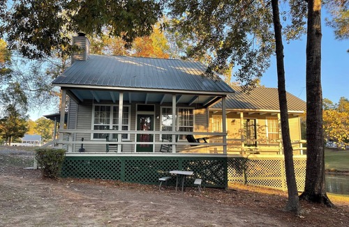 Zwolle Cabin | Couples Retreat with King Canopy Bed, Jacuzzi for Two, Fireplace & Pond-View Porch
