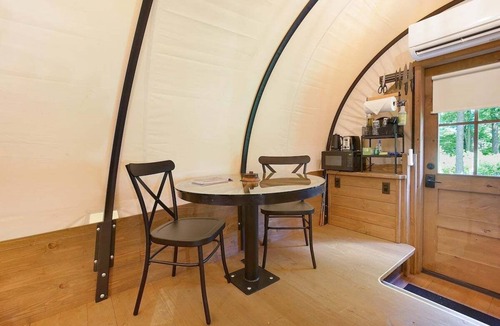 Strasburg RV Rental | Covered Wagon Camping along Creek, Sleeps 4