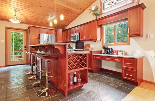 Onanole Cottage | Cozy 3BR Lakefront Retreat Featuring Sauna, Hot Tub, Kayaks
