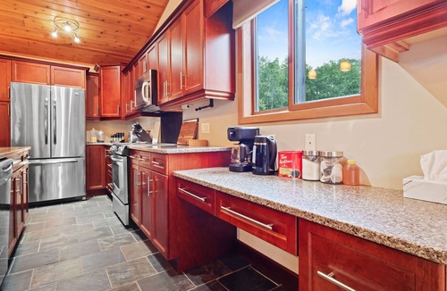 Onanole Cottage | Cozy 3BR Lakefront Retreat Featuring Sauna, Hot Tub, Kayaks