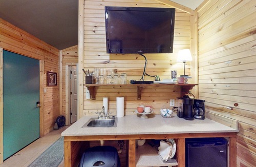 Paige Cabin | Cozy cabin w/covered porch, relaxing hammock & porch swing